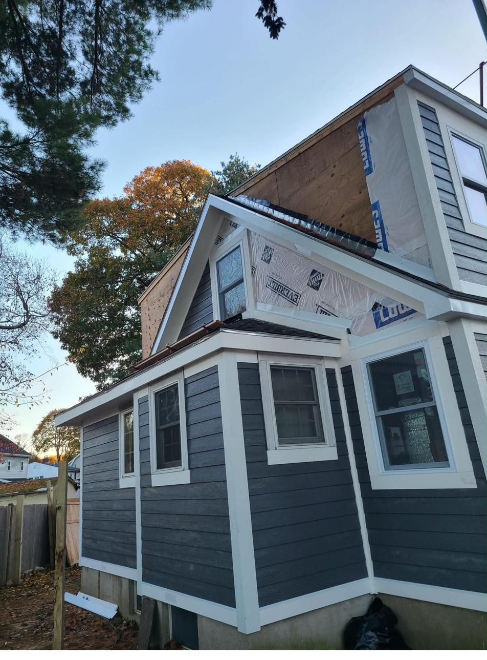 Exterior siding installation in progress on residential home